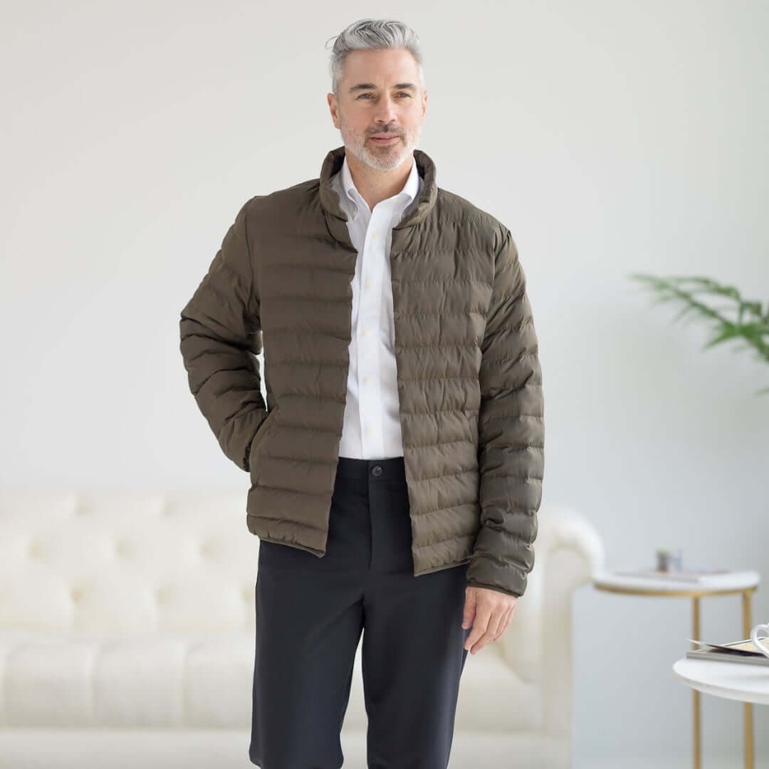 Man wearing olive Weatherproof x MagnaReady magnetic front water-resistant puffer jacket, showcasing modern design.