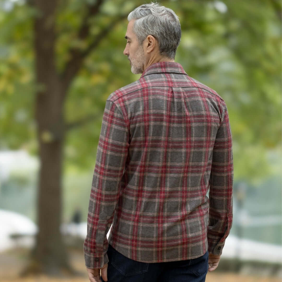 Man wearing an adaptive brown glen plaid flannel shirt, showcasing a stylish layering design for fall.