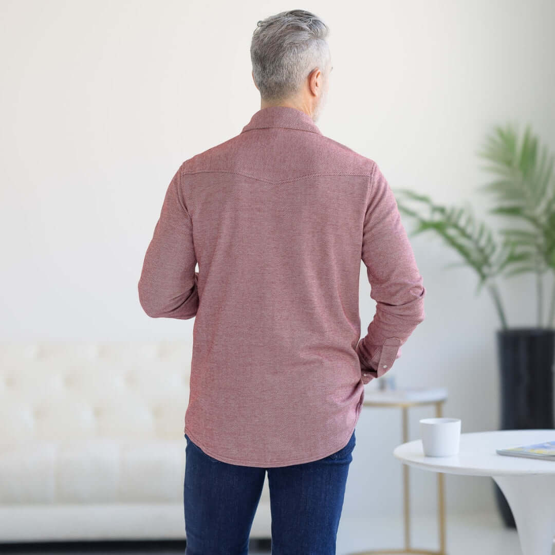 Back view of a man wearing a Rio Red adaptive casual Western knit twill shirt with magnetic buttons.