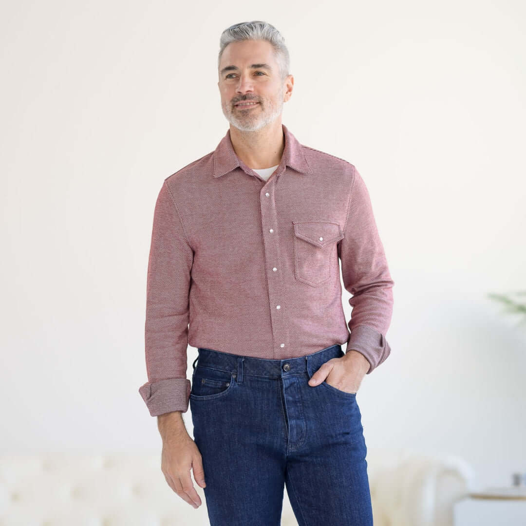 Man wearing a Rio Red adaptive Western twill knit shirt with magnetic buttons and chest pocket, styled with jeans.
