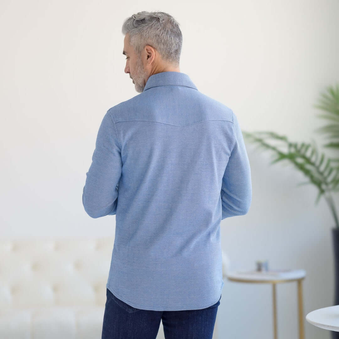 Back view of a man wearing an adaptive casual Western shirt in Star Sapphire with magnetic buttons.