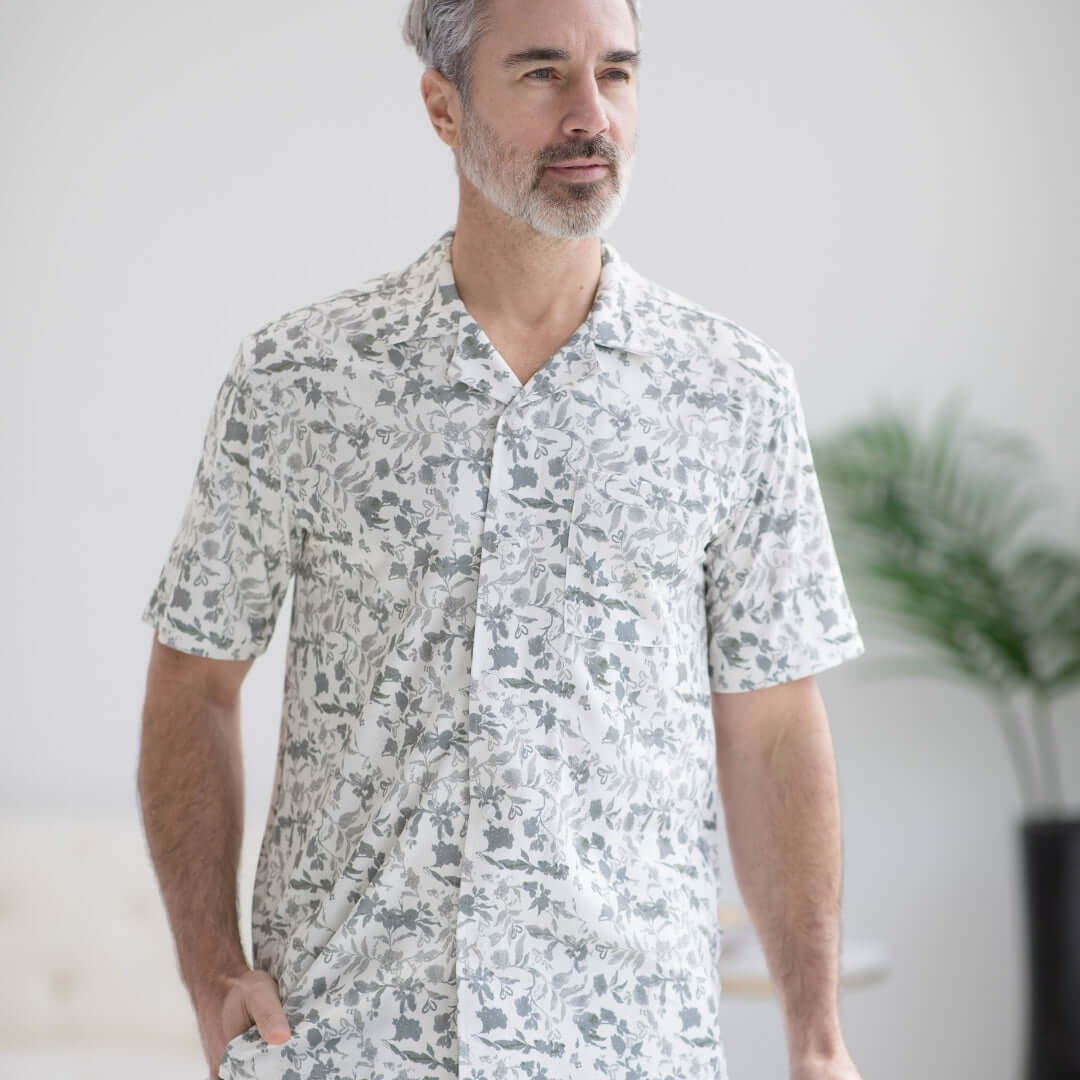 Man wearing a grey floral untucked short sleeve cooling shirt designed for comfort and accessibility.