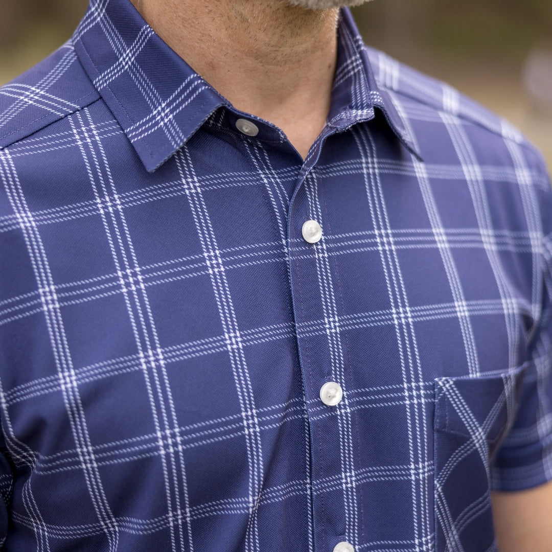 Adaptive Cooling Magnetic Front Short Sleeve Shirt in Navy Windowpane close-up, featuring checkered design for comfort.
