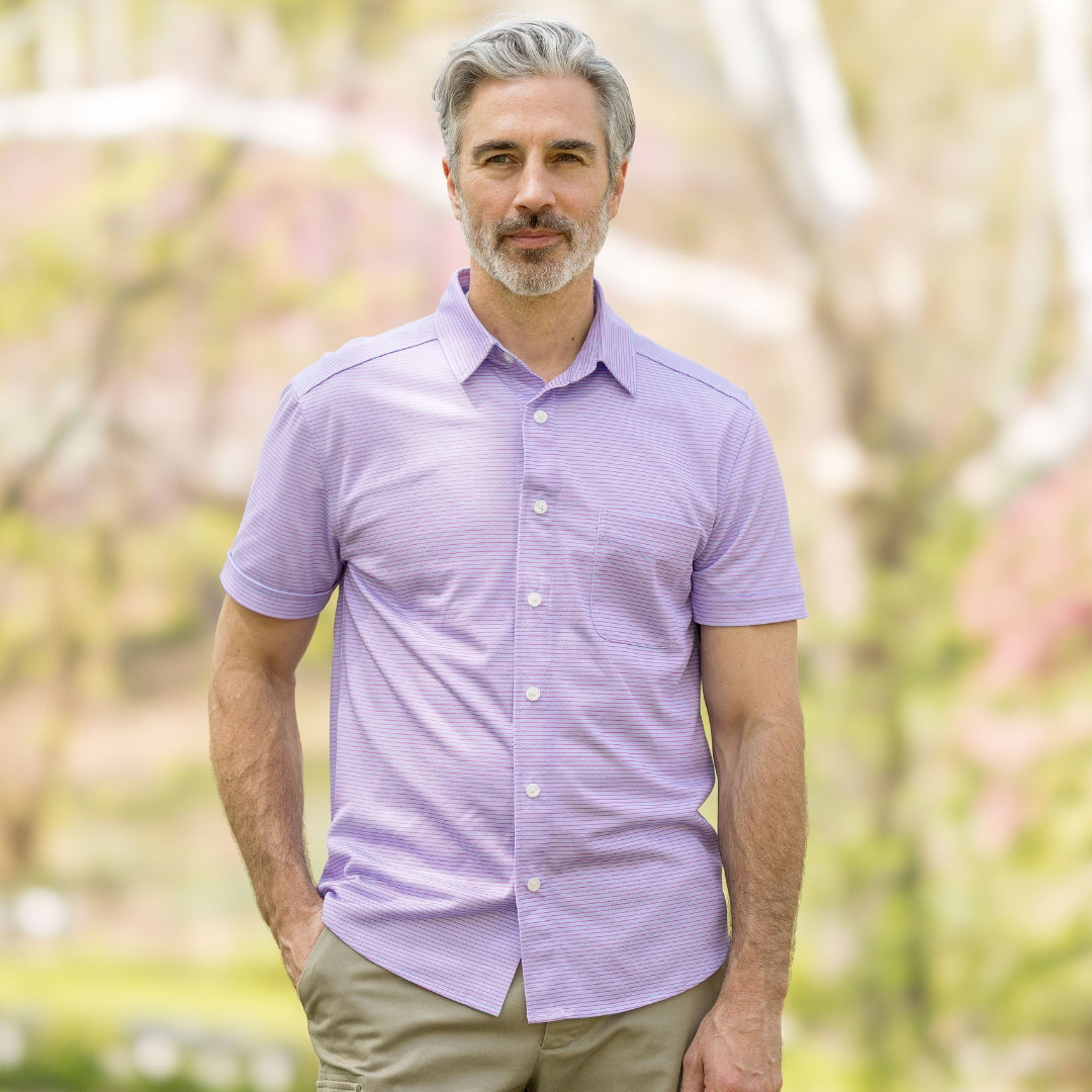 Adaptive Cooling Magnetic Front Short Sleeve Shirt in Pink and Blue Stripe worn by a man outdoors.