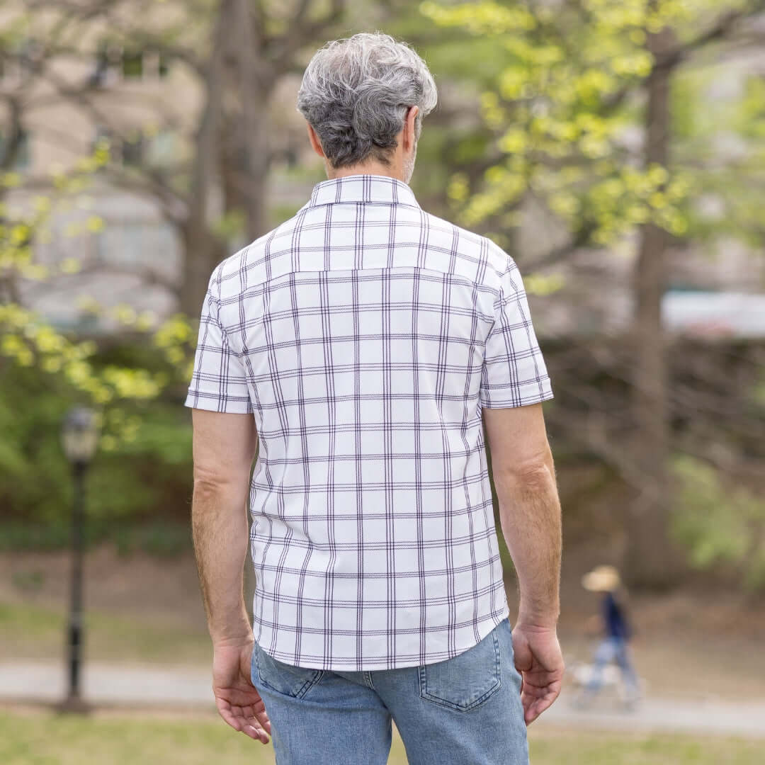 Adaptive Cooling Magnetic Front Short Sleeve Shirt in White Windowpane worn by man from behind, showcasing its comfortable design.