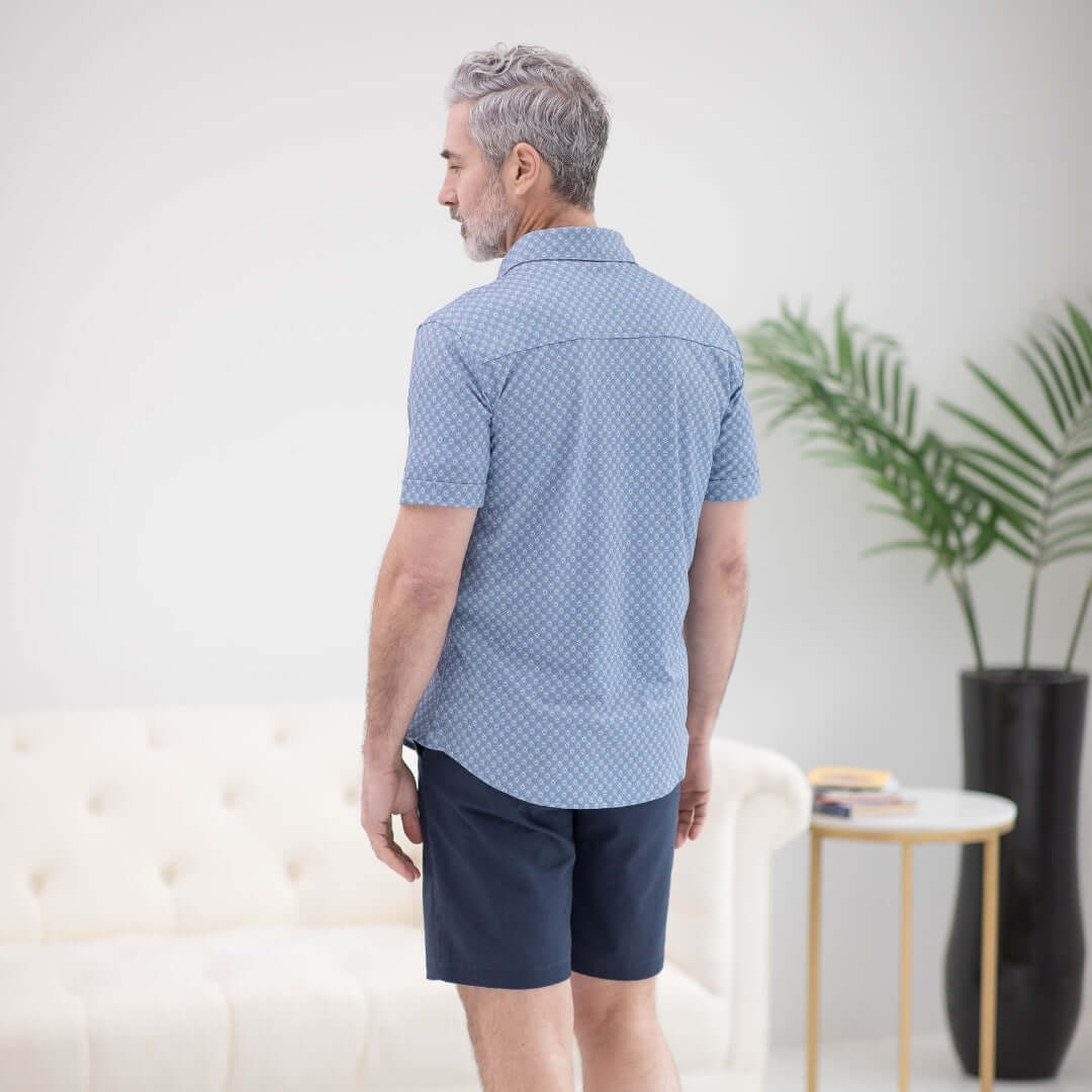 Back view of man in Adaptive Cooling Magnetic Short Sleeves Shirt, designed for comfort and ease of movement.