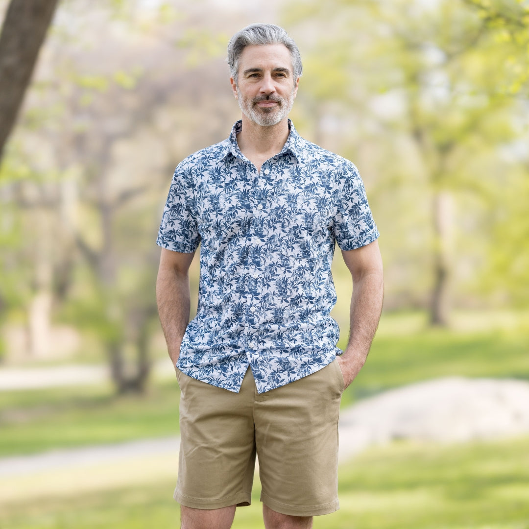 Adaptive Cooling Magnetic Front Short Sleeve Shirt in Blue Grey Palm worn by man outdoors