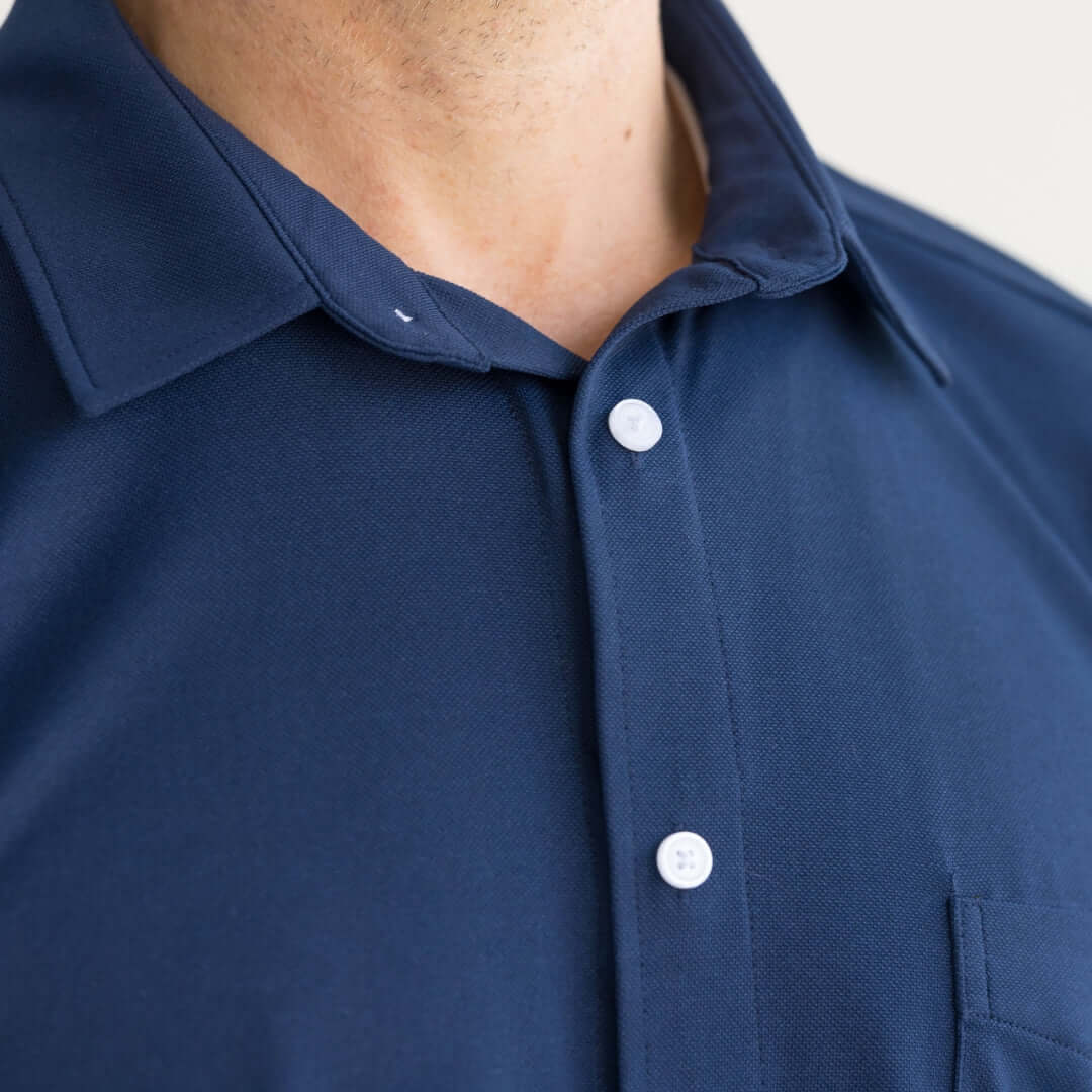Navy blue adaptive cooling magnetic shirt designed for comfort and mobility support in individuals with limited movement.