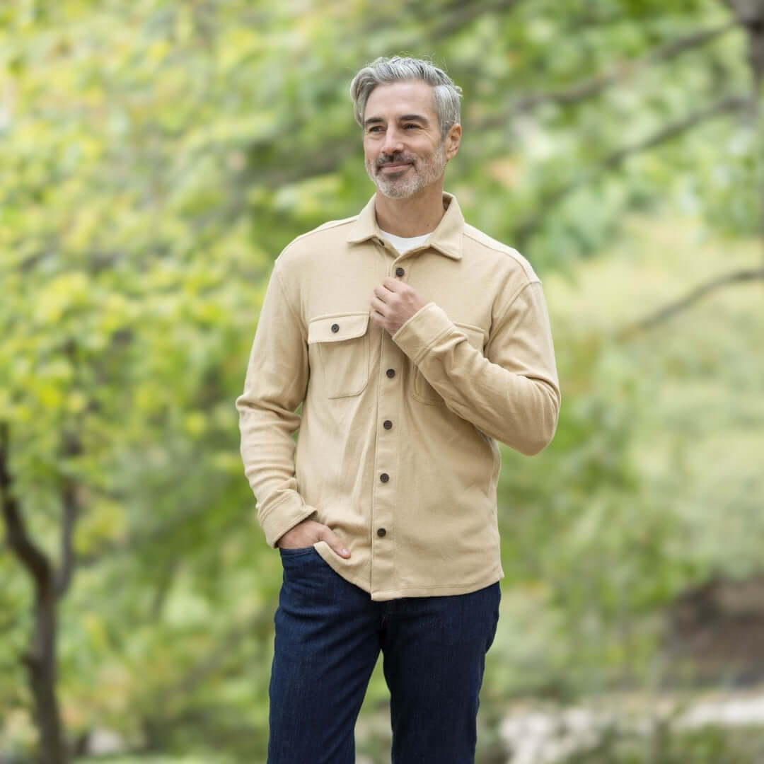 Man wearing a khaki flannel shirt outdoors, showcasing versatility for layering in autumn fashion.