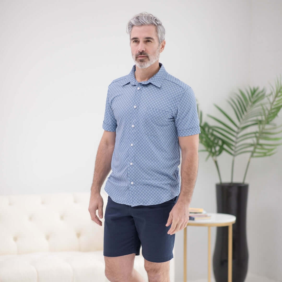 Man wearing adaptive cooling magnetic shirt in blue diamond, designed for comfort and mobility support.