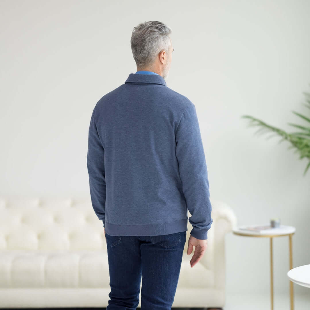 Back view of a man wearing the Adaptive Magnetic Front Sweatshirt in Heathered Navy, designed for comfort and mobility.