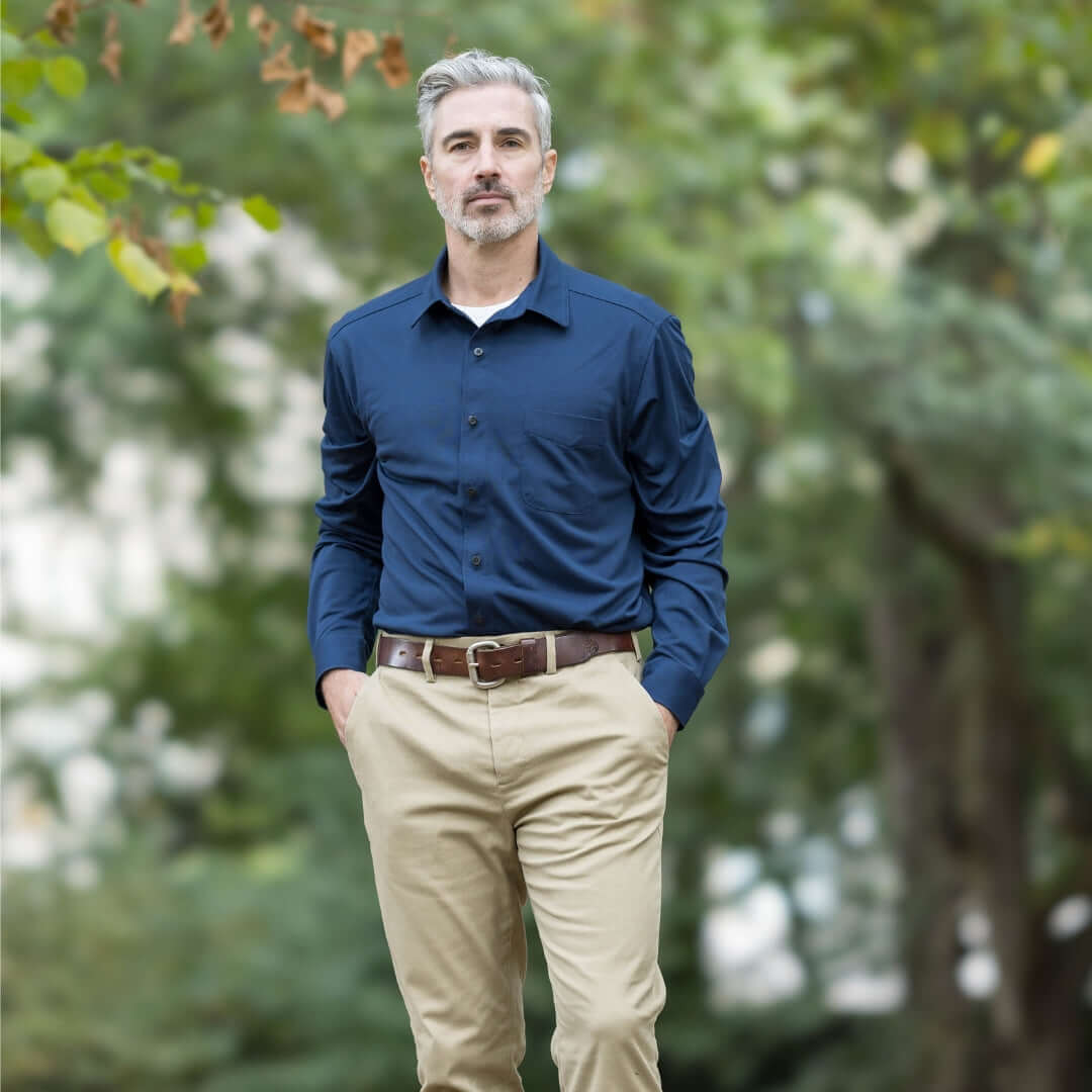 Adaptive True Navy long sleeve cooling polo shirt with magnetic buttons, paired with khaki pants.