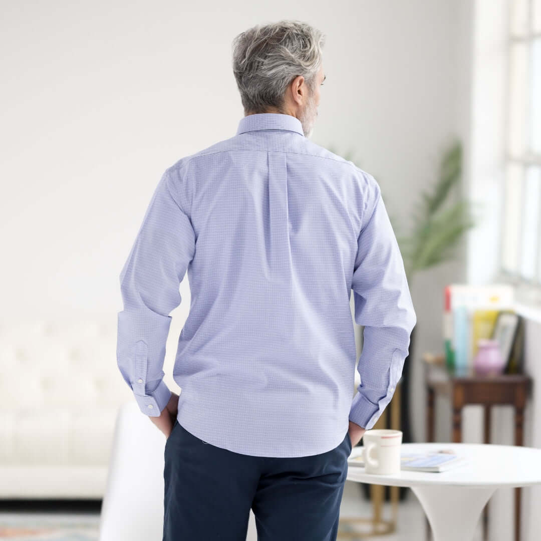 Man in blue and green check long sleeve shirt with button-down collar, showcasing modern wardrobe style.