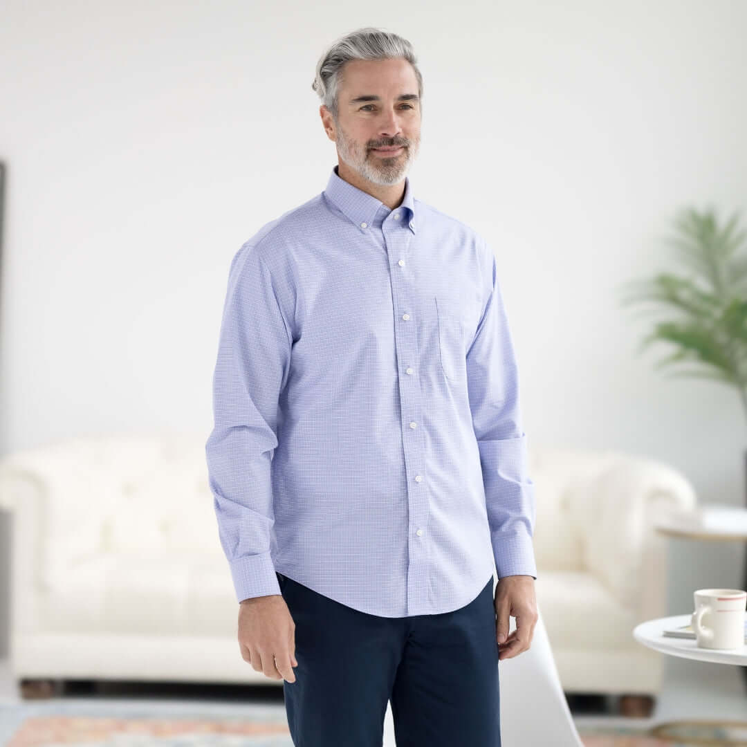 Man wearing a blue and green check long sleeve button-down collar shirt with magnetic closures.