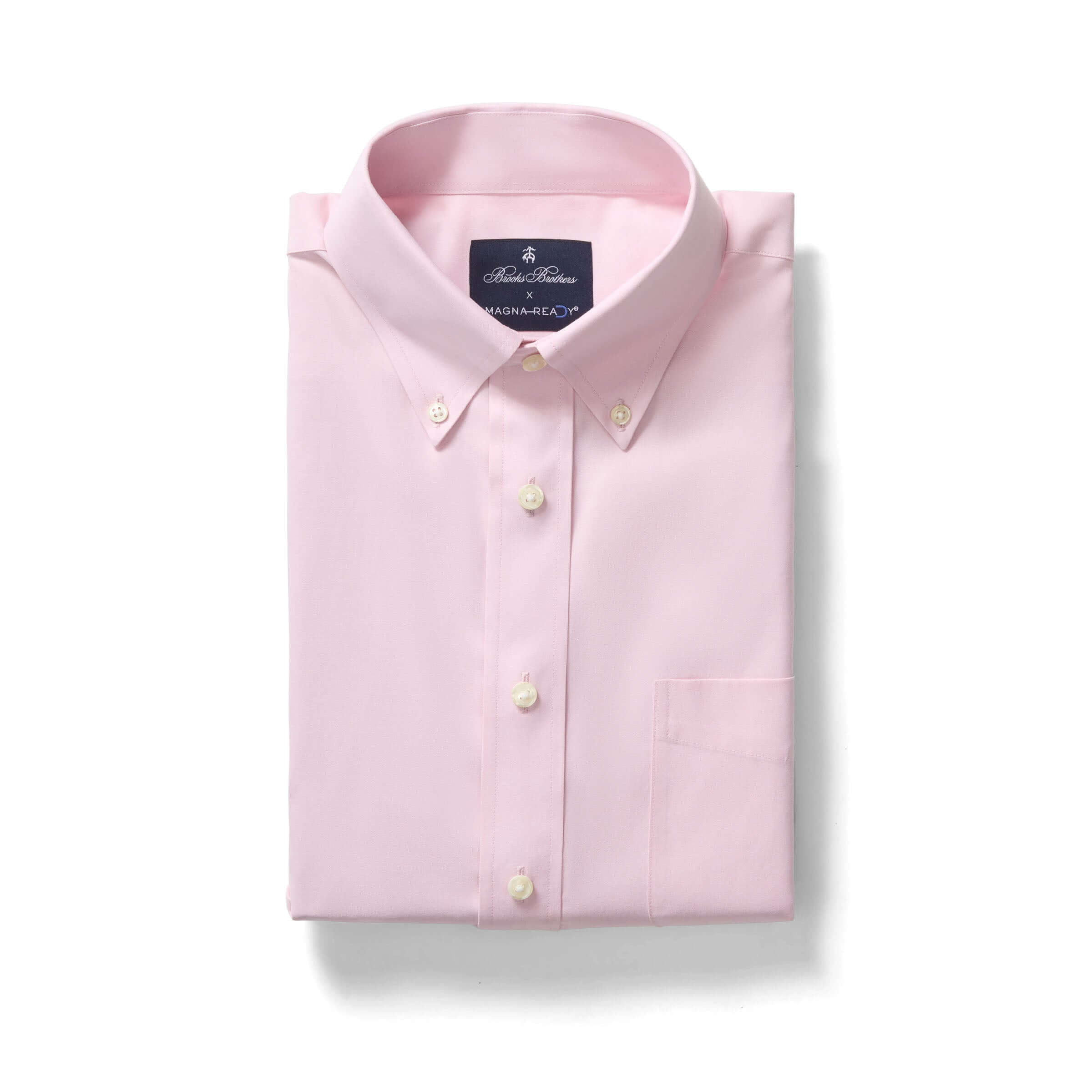 Brooks Brothers x MagnaReady pink polo shirt with button-down collar and magnetic closures, folded neatly.