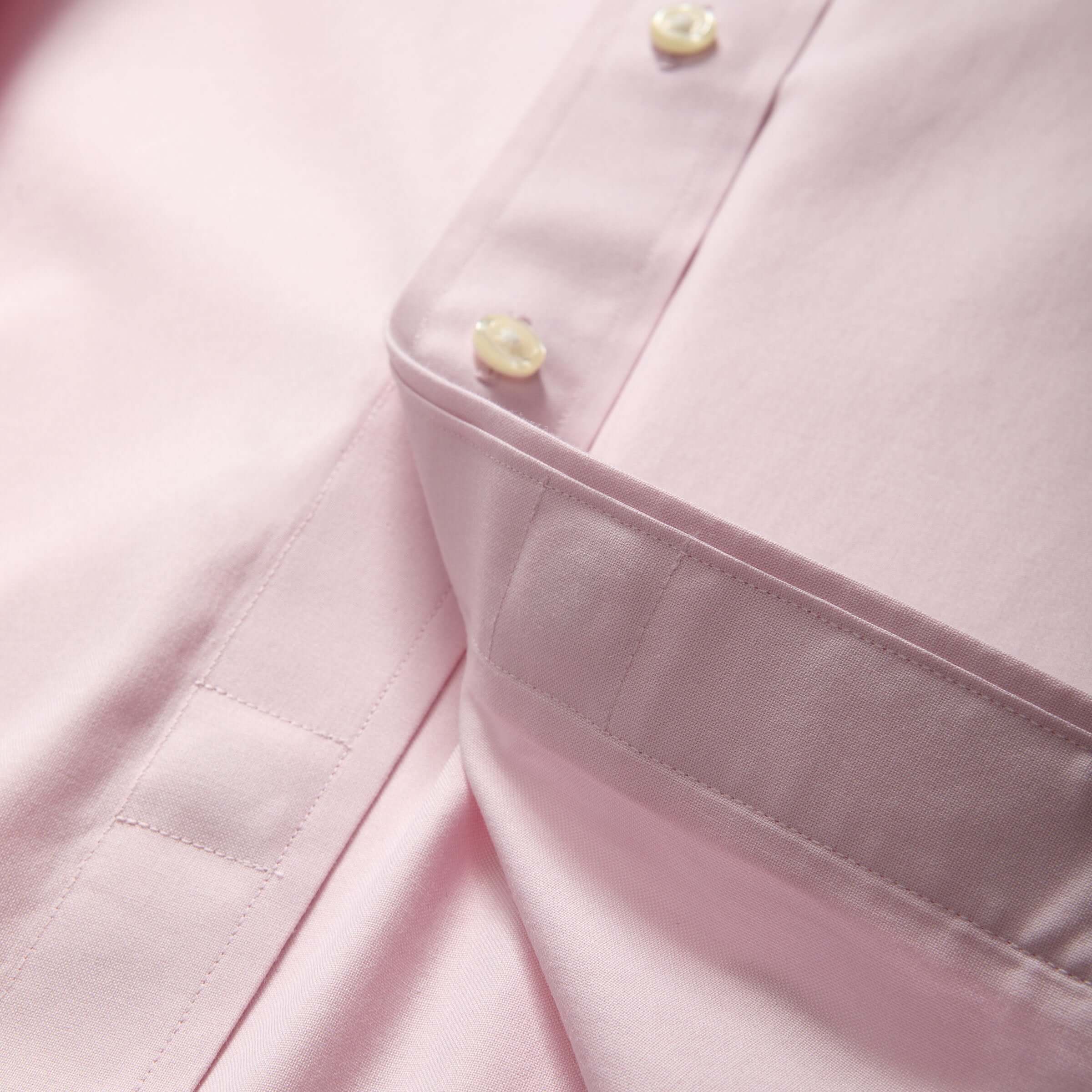 Close-up of Brooks Brothers x MagnaReady pink polo shirt showcasing button-down collar and magnetic closures.