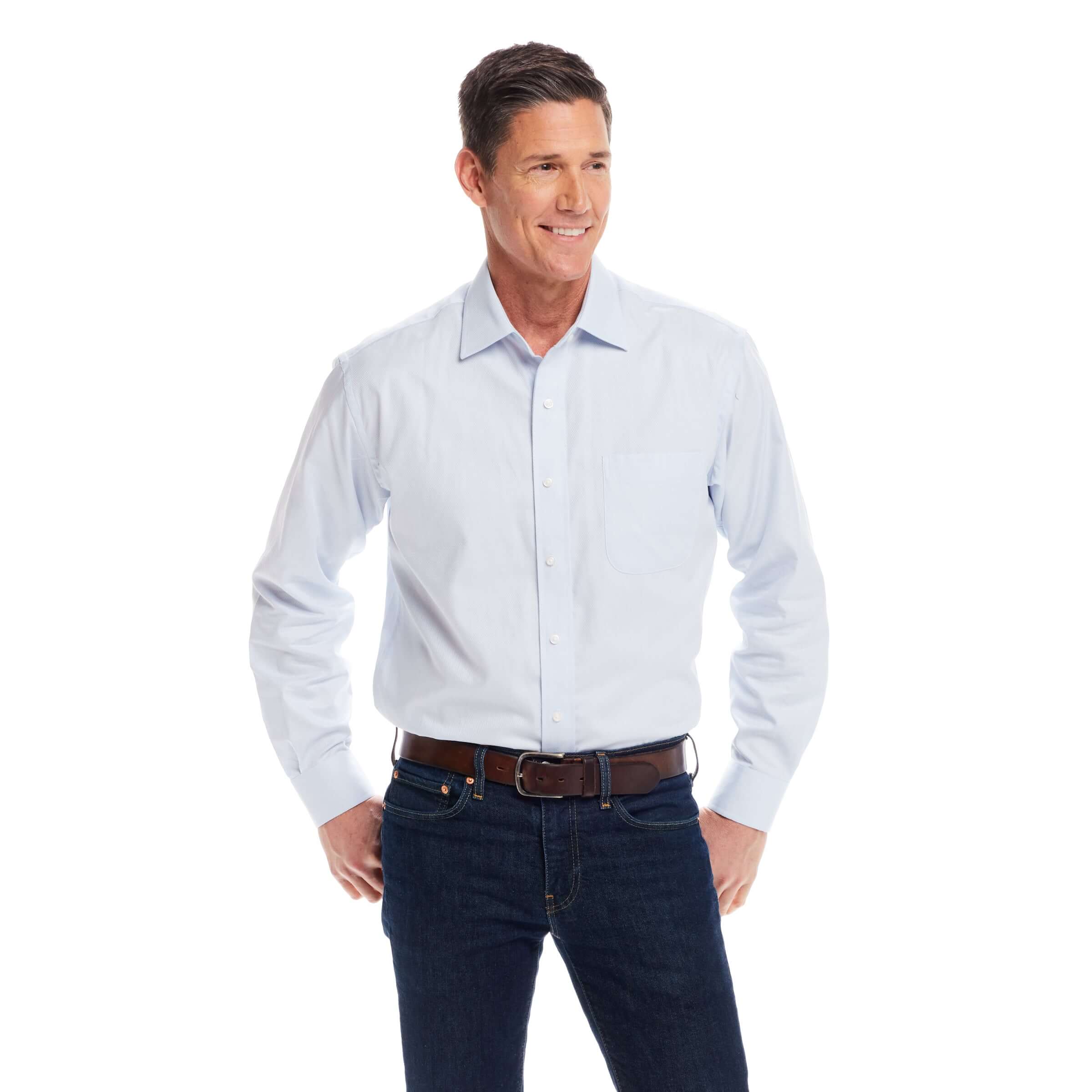 Man wearing a classic light blue 'Ryan' dress shirt with magnetic closures, featuring a spread collar and traditional fit.