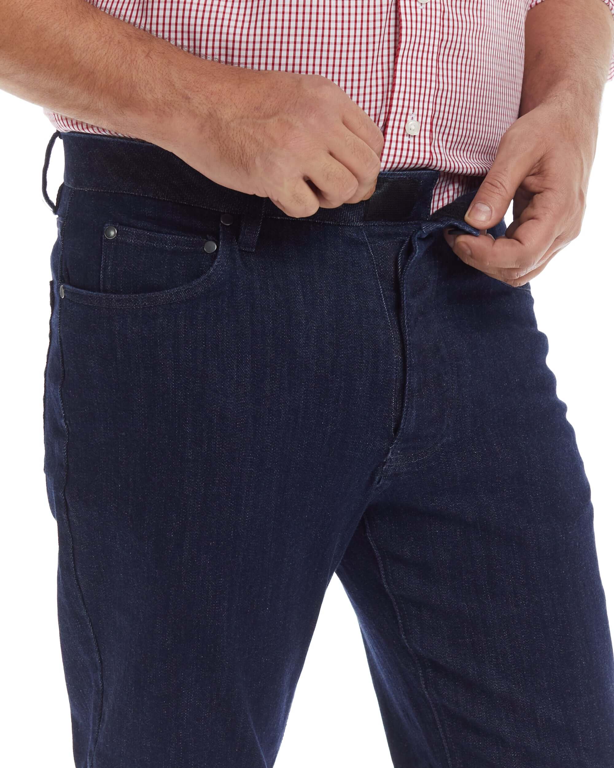 Man wearing indigo MVP Five Pocket Jean with magnetic closures, showcasing innovative design and comfort.