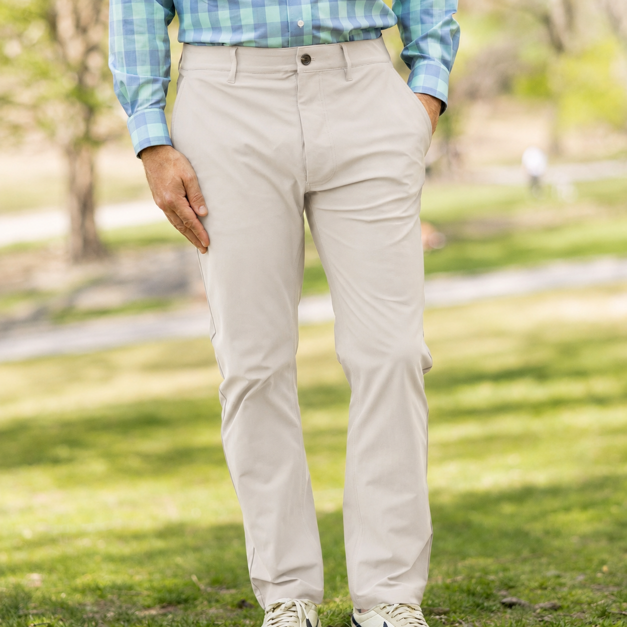 Flat Front Adaptive Stretch Tech Pant with Magnetic Closures - Stone on a model in a park setting.