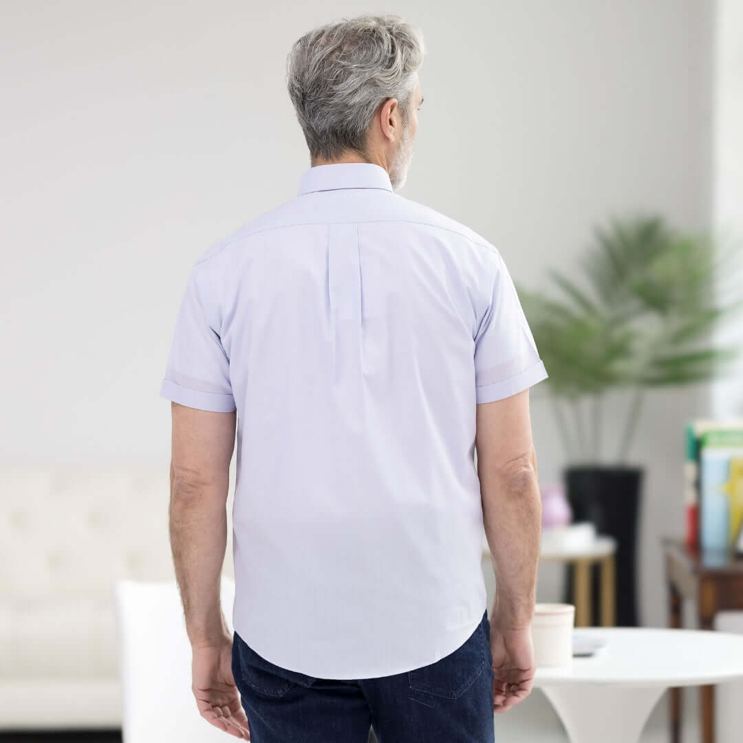 Back view of a man wearing a lavender short sleeve button-down collar shirt, showcasing a modern, classic style.