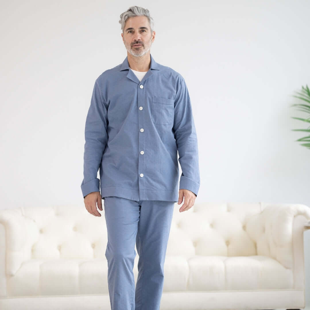 Long Sleeve Blue Brushed Flannel Pajama Top with Magnetic Closures modeled by a man in a cozy living room.