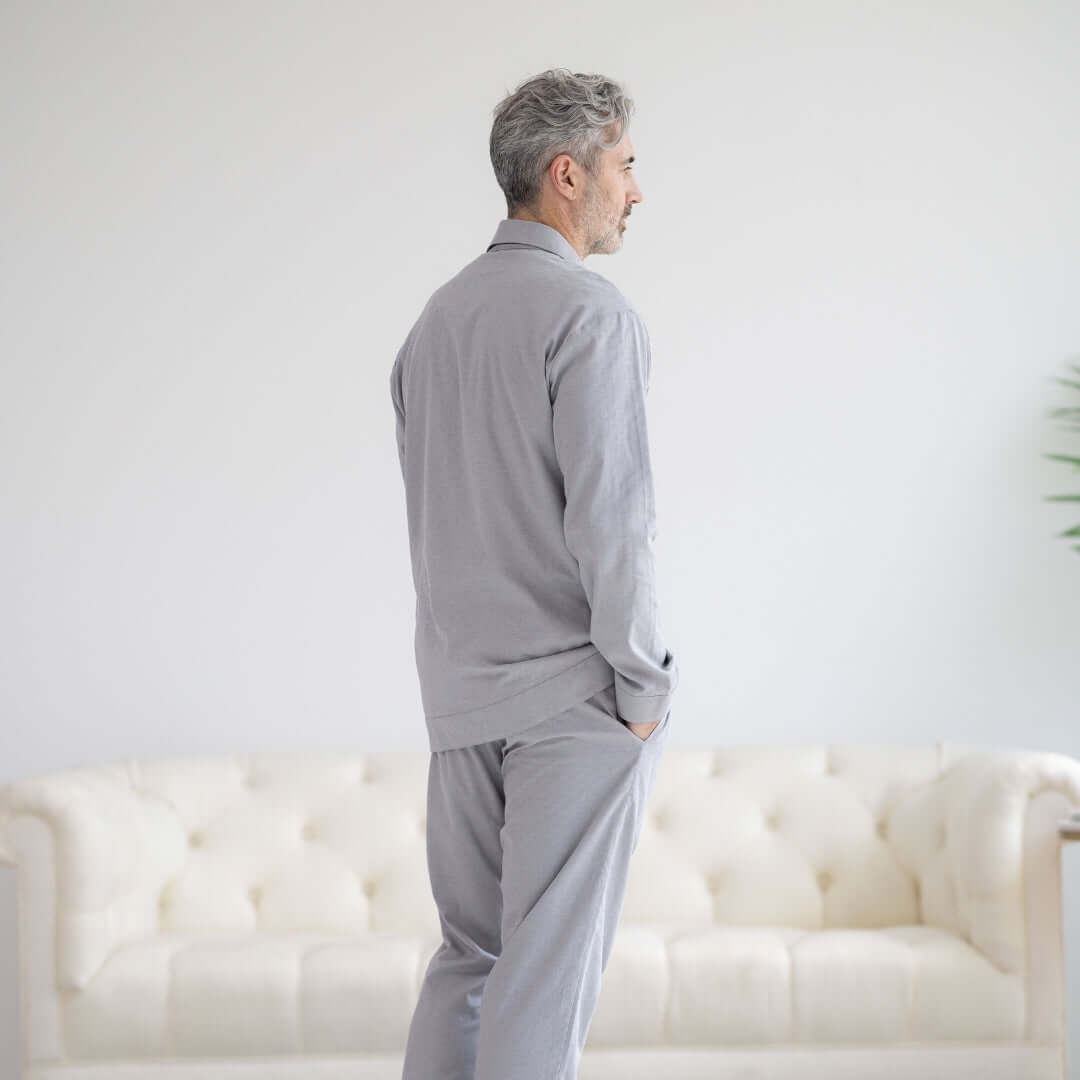 Long Sleeve Grey Pajama Top with Magnetic Closures, man wearing grey pajamas, comfortable sleepwear at home.
