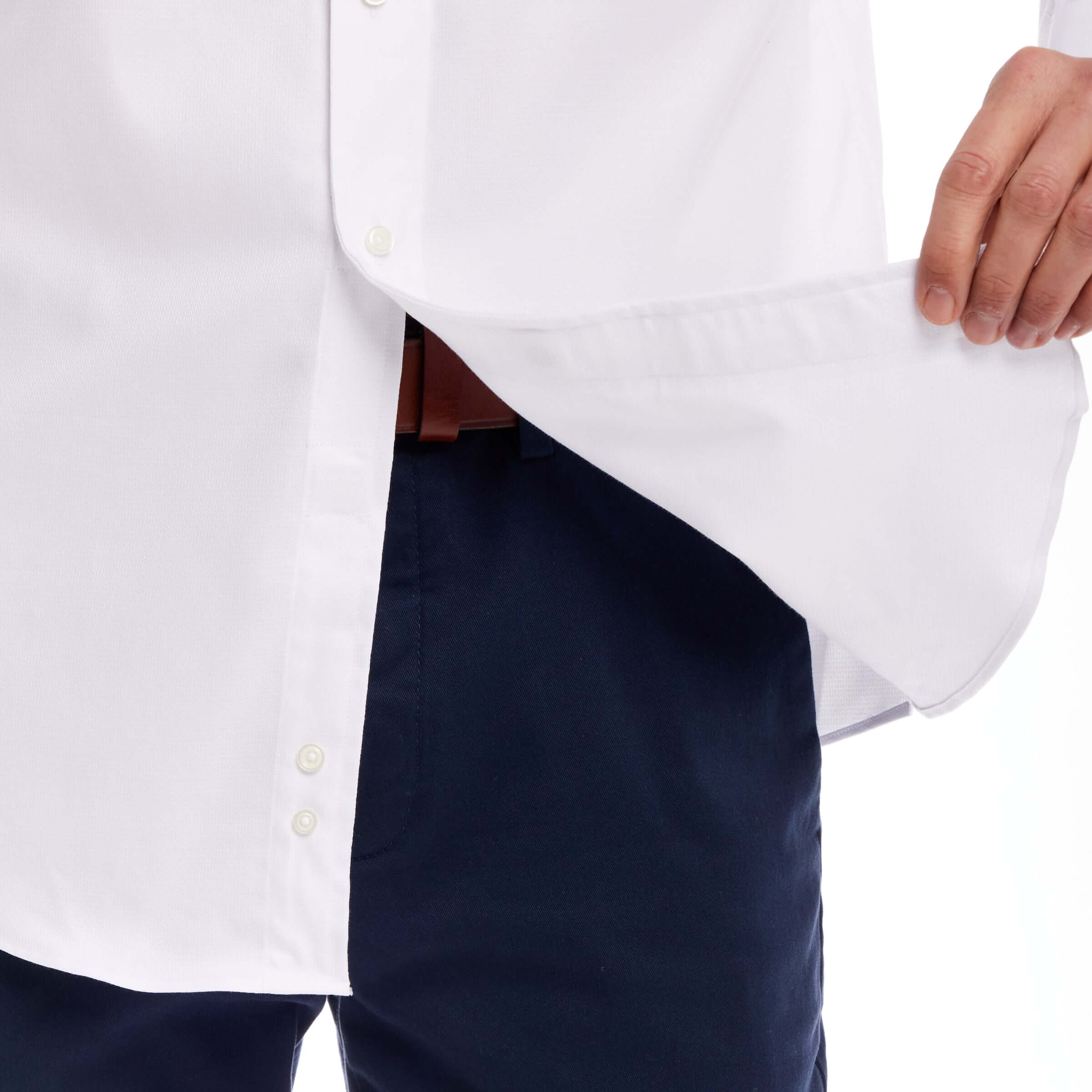 Close-up of the long sleeve white 'Ryan' dress shirt showcasing the button detail and side hem.