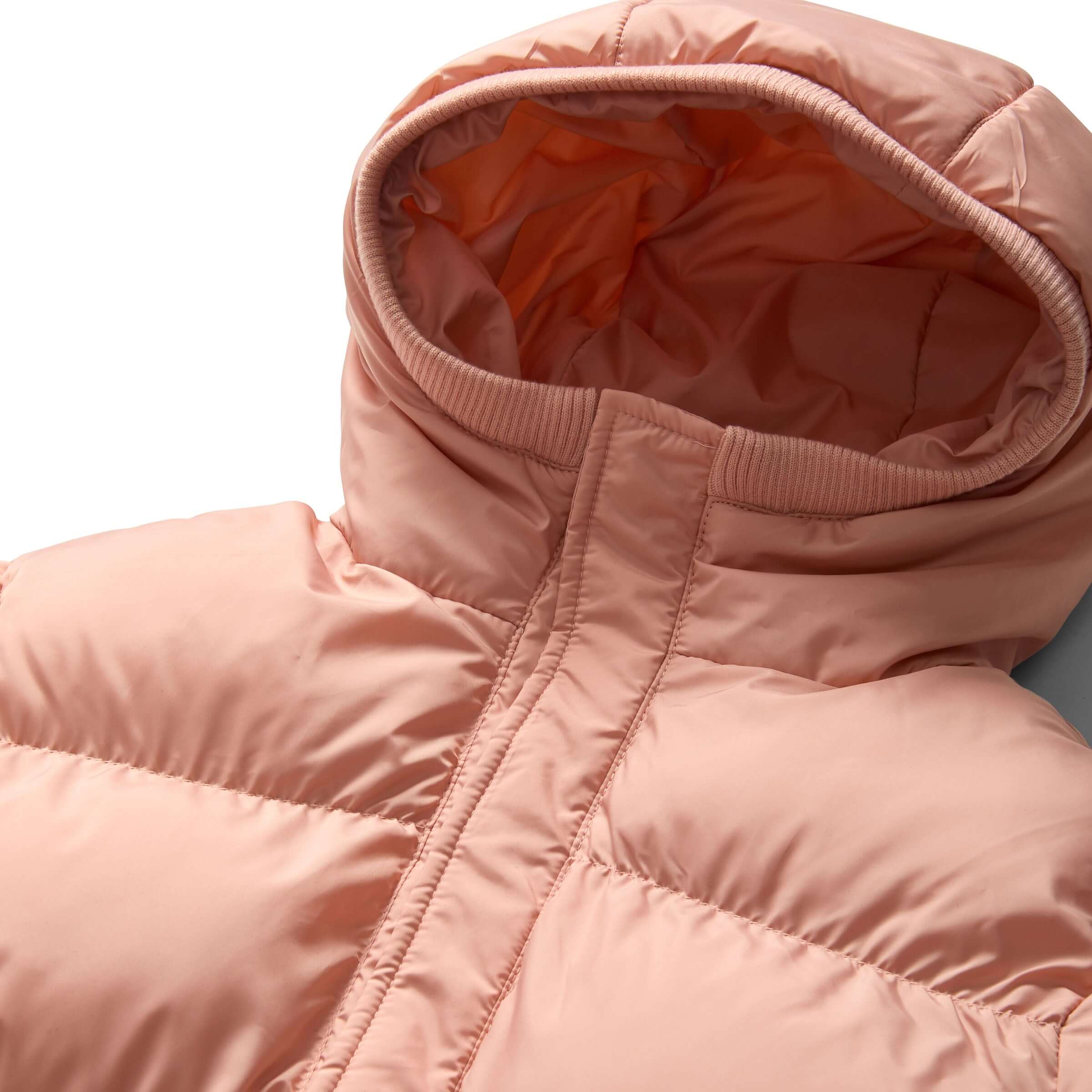 Pink kids magnetic puffer coat with hood showing cozy fabric and zipper details, perfect for independent dressing.