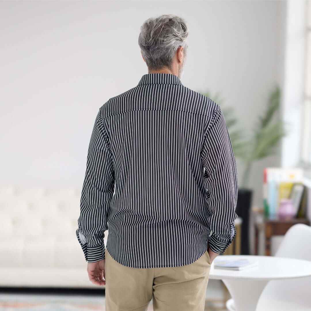 Back view of a man wearing a black stripe MagnaReady long sleeve tech shirt.