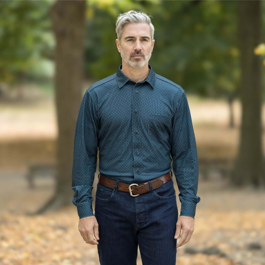 Man wearing MagnaReady blue check long sleeve shirt in a park, showcasing magnetic buttons and comfort.