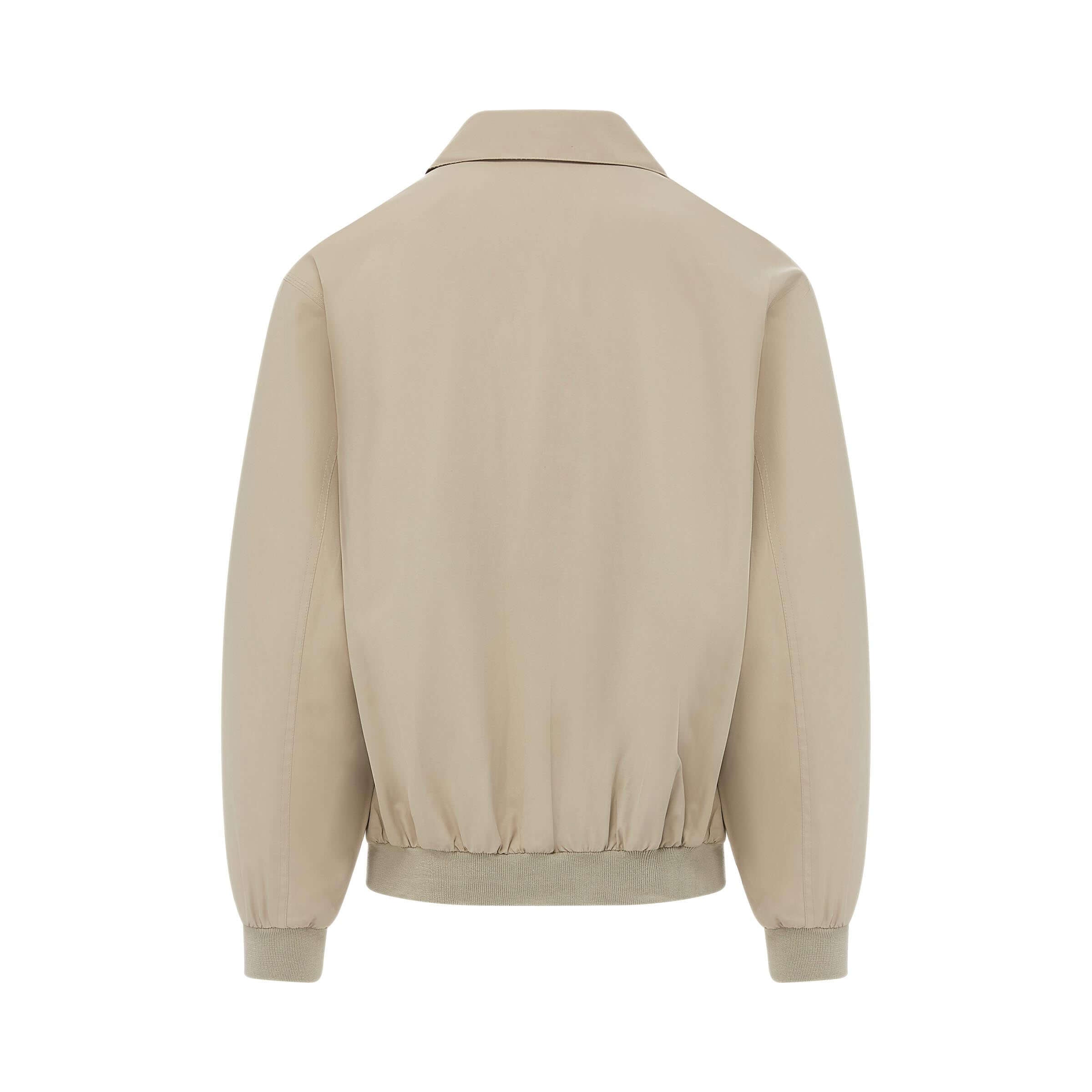 MagnaReady x Weatherproof classic golf jacket in new stone, showcasing back view with elastic hem and collar.