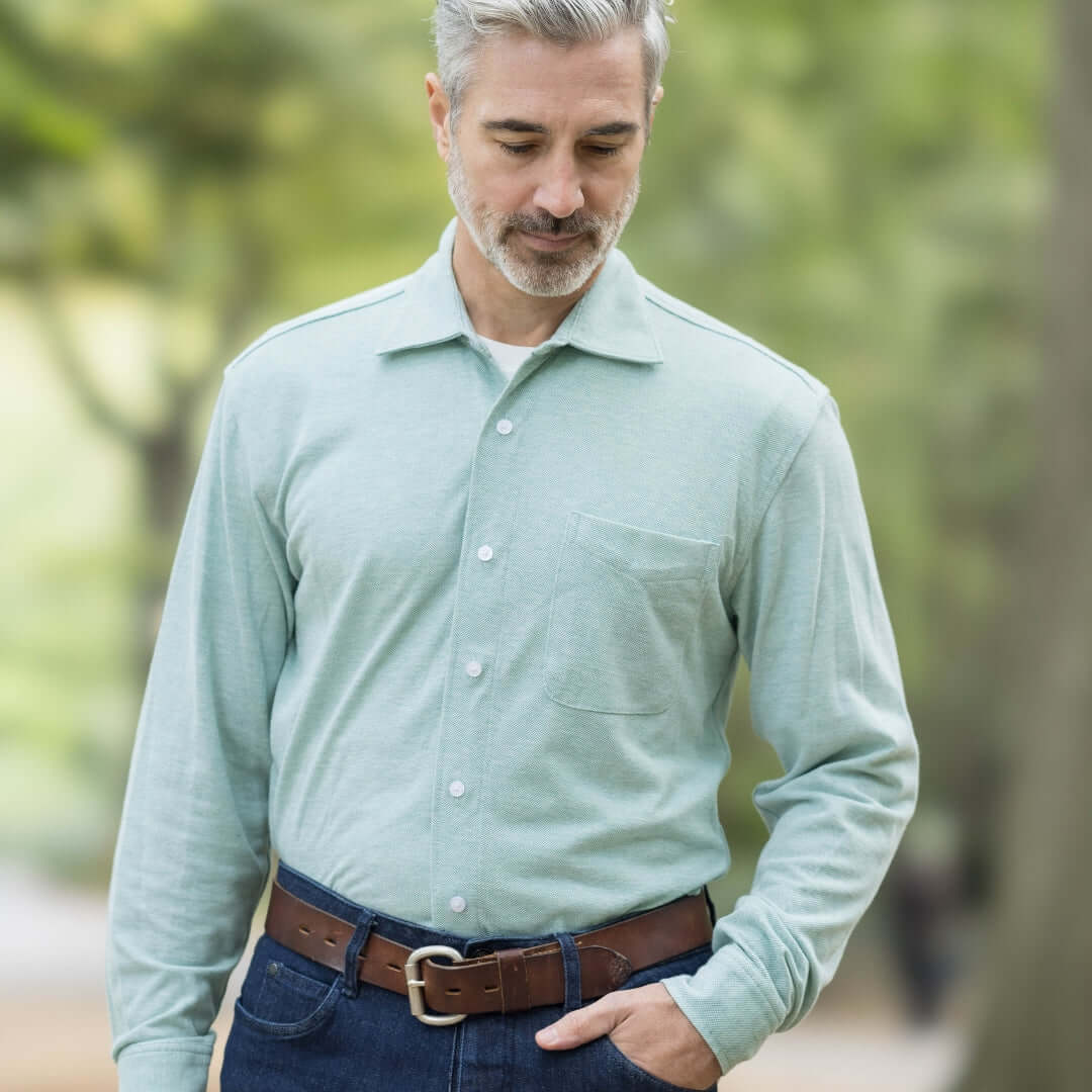 Man wearing an Ivy Green long sleeve Knit Oxford shirt with pocket, showcasing MagnaReady Magnetic Closure technology.