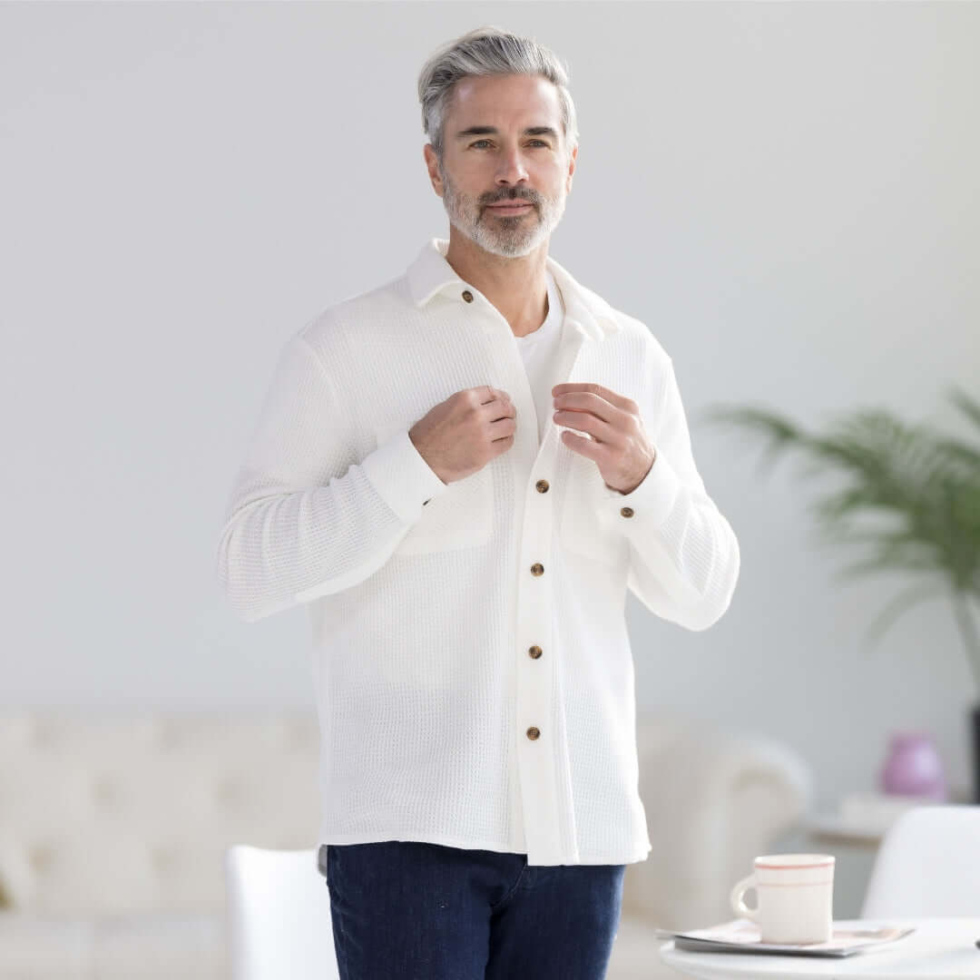 Man wearing a white waffle weave casual shirt with oversized pockets, showcasing comfort and style.