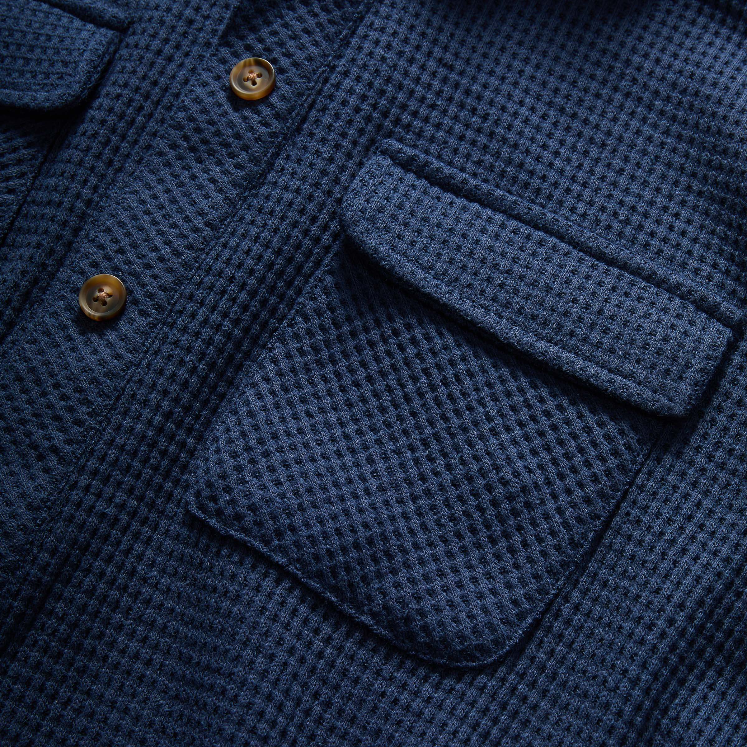 Close-up of navy blue Magnetic Front WaffleWeave Casual Shirt featuring dual pockets and wooden buttons.