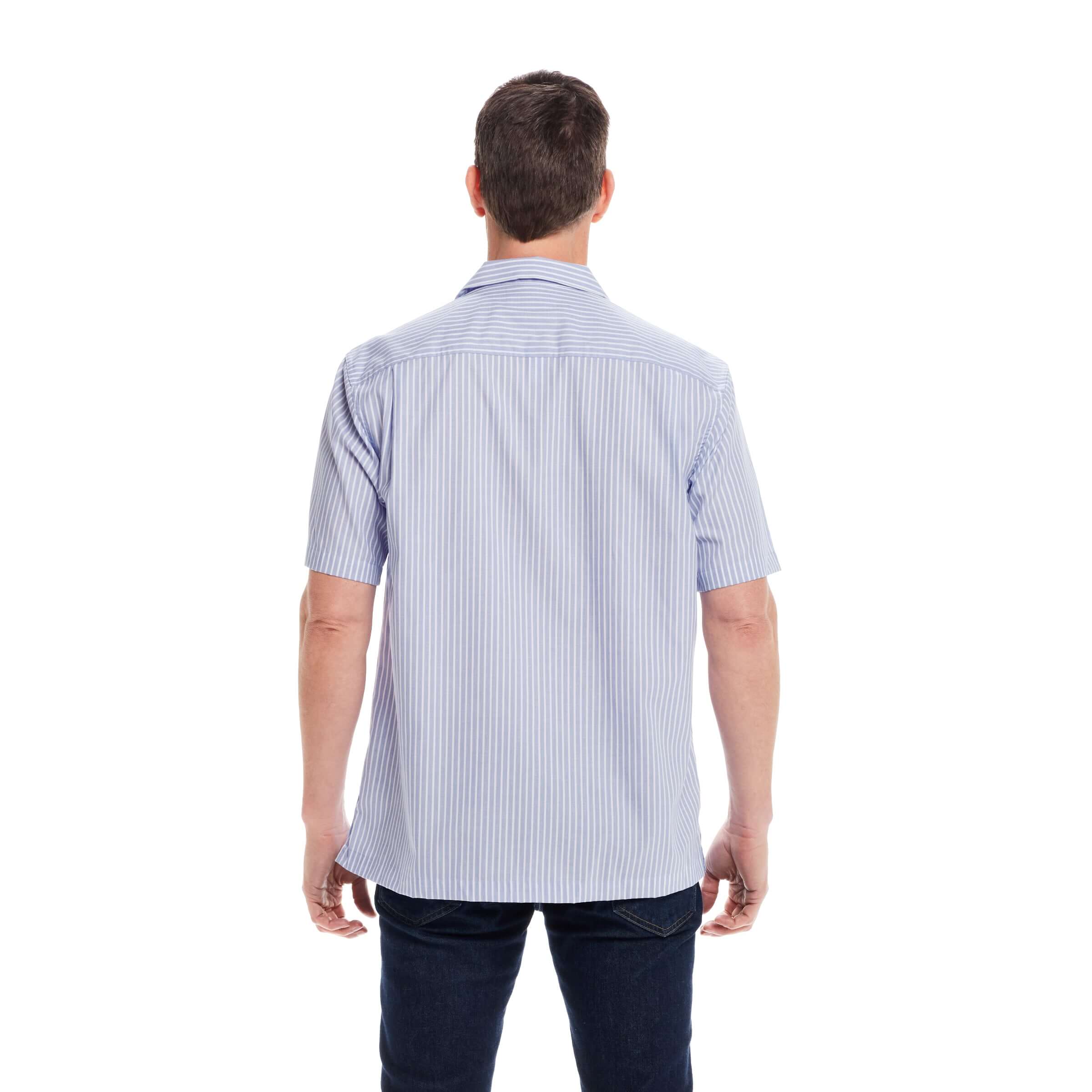 Back view of a man wearing a short sleeve blue stripe untucked Landry camp shirt with magnetic closures.