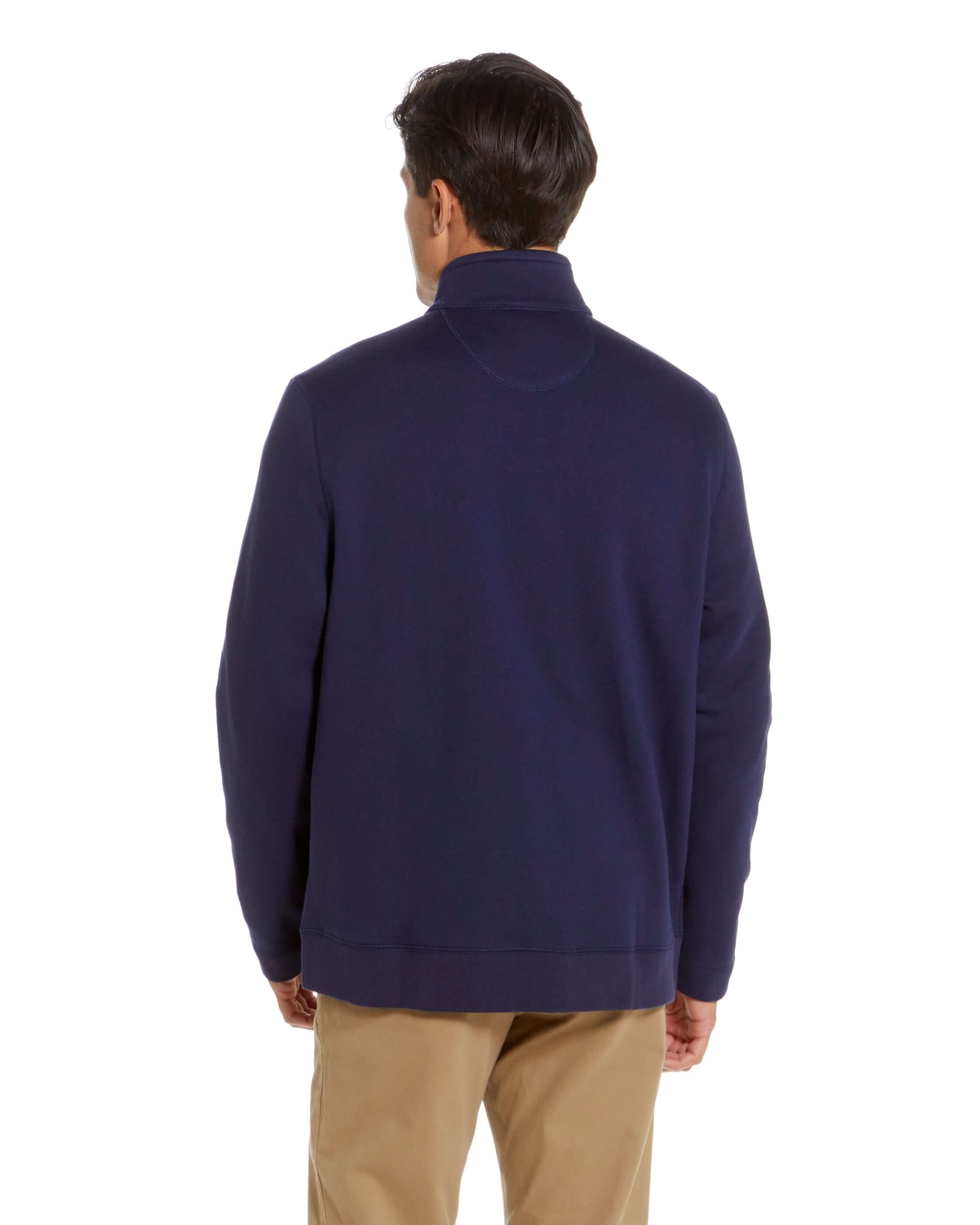 Man wearing the navy knit fleece Dillon jacket, showcasing the back view and stylish design.