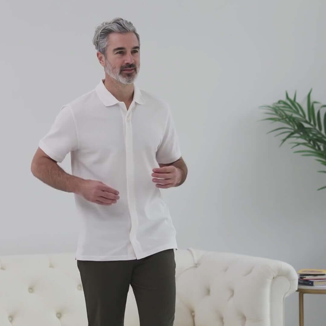 White pique knit short sleeve polo with magnetic closures, perfect for easy dressing and adaptive style.