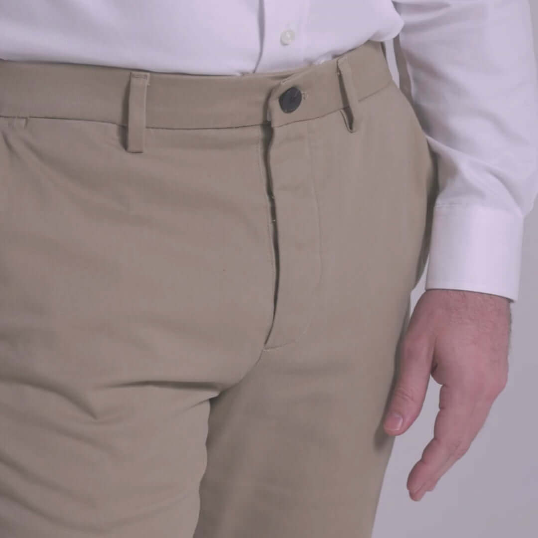 Flat front adaptive chino pant in khaki, designed for comfort and ease with magnetized fly and Velcro closure.