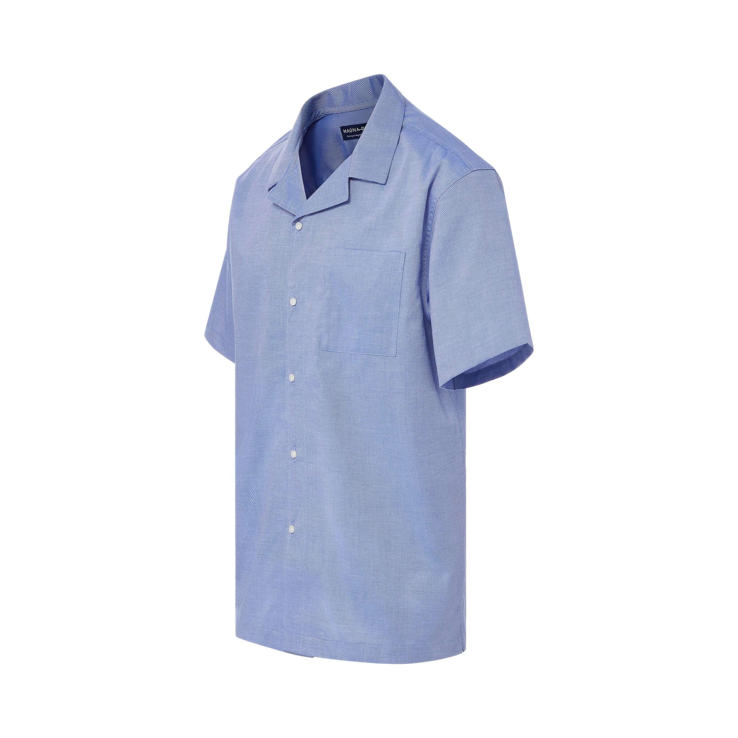 Short sleeve untucked solid blue 'Landry' camp shirt with magnetic closures for stylish comfort.