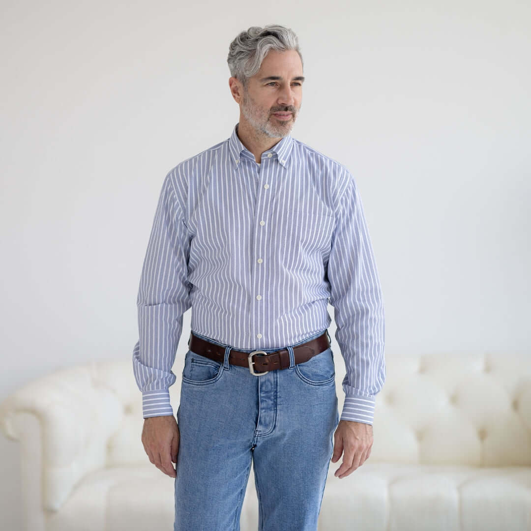 Man wearing a blue stripe button-down shirt with magnetic closures, designed for easy dressing and comfort.