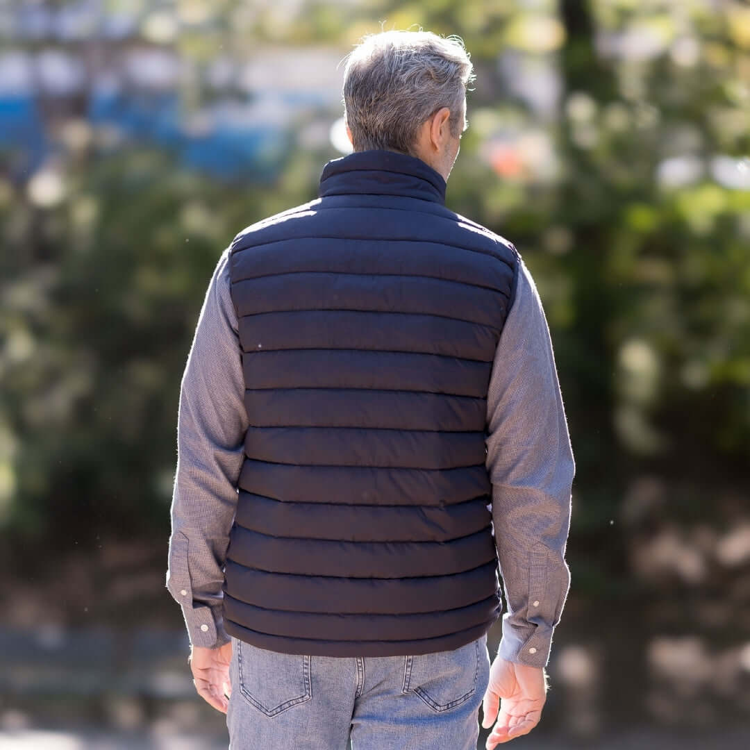 Weatherproof® X MagnaReady® Puffer Magnetic Front Black Vest - back view on a model outdoors.