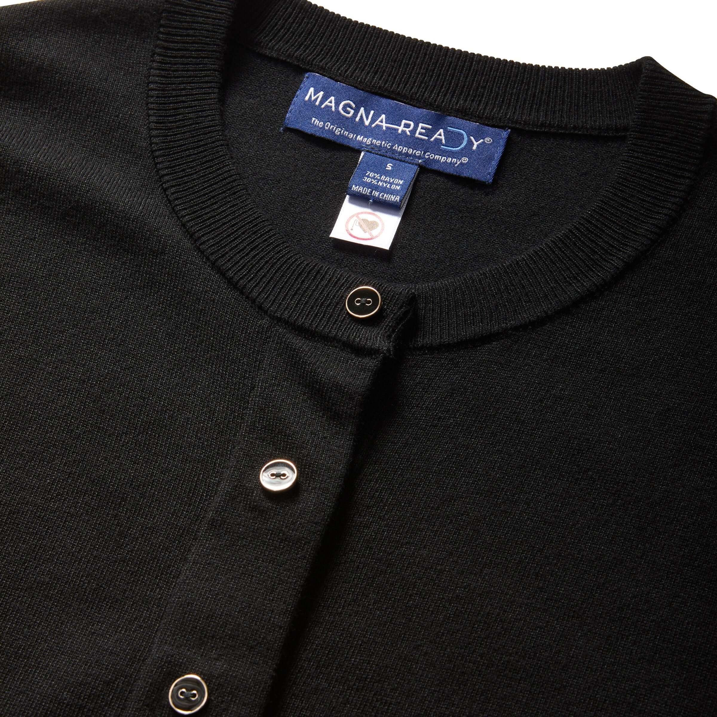 Close-up of black women's adaptive cardigan with MagnaReady® label and button details for easy dressing.