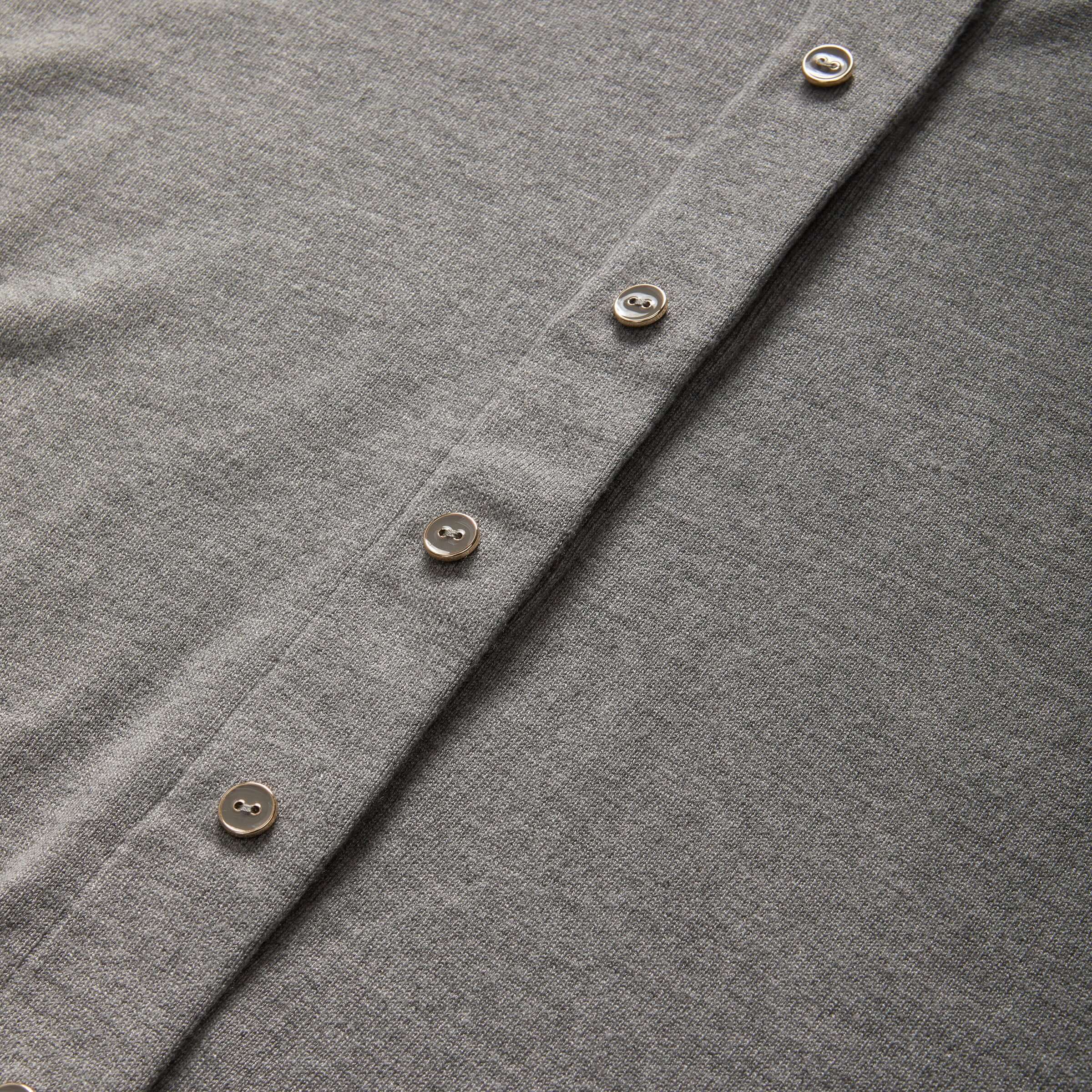 Close-up of grey women's adaptive cardigan sweater with buttons, featuring MagnaReady® magnetic technology for easy dressing.