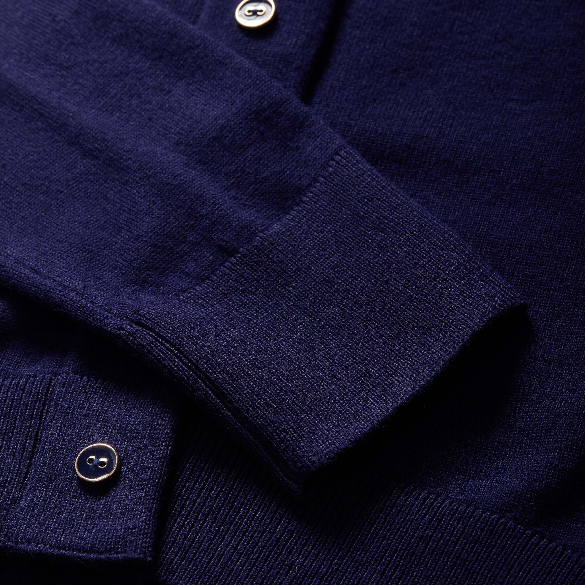 Close-up of women's adaptive navy cardigan sweater showcasing knit texture and button details.