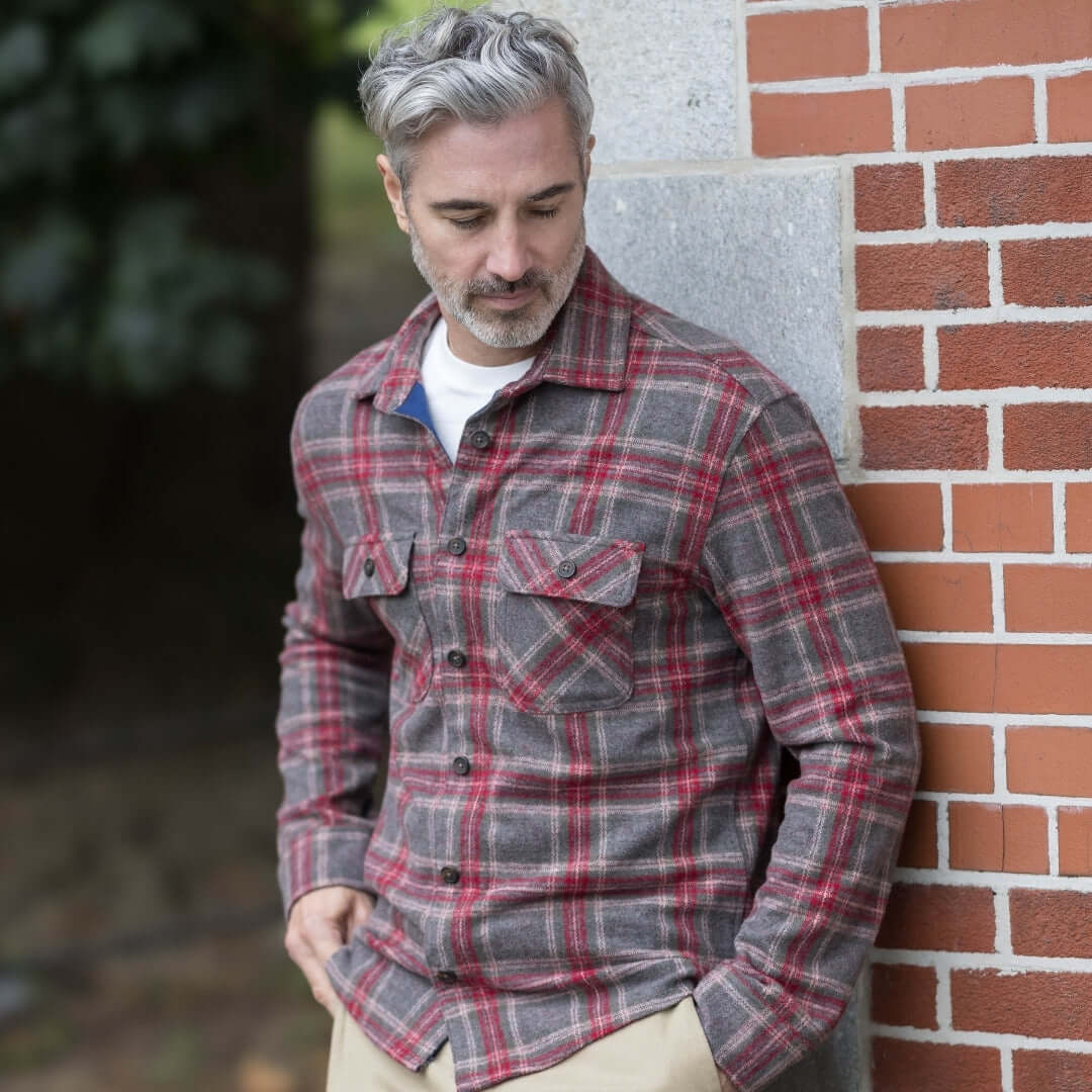 Man wearing Adaptive Brown Glen Plaid Flannel Shirt, styled for outdoor comfort and versatility.