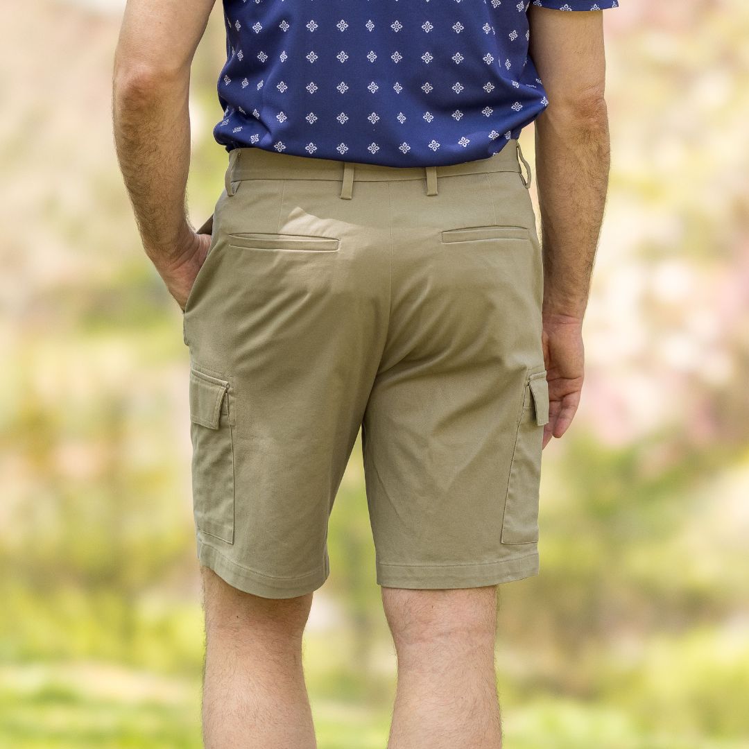 Adaptive Cargo Twill Short with Magnetic Closures - Stone, showing the back view of the shorts in a natural setting.
