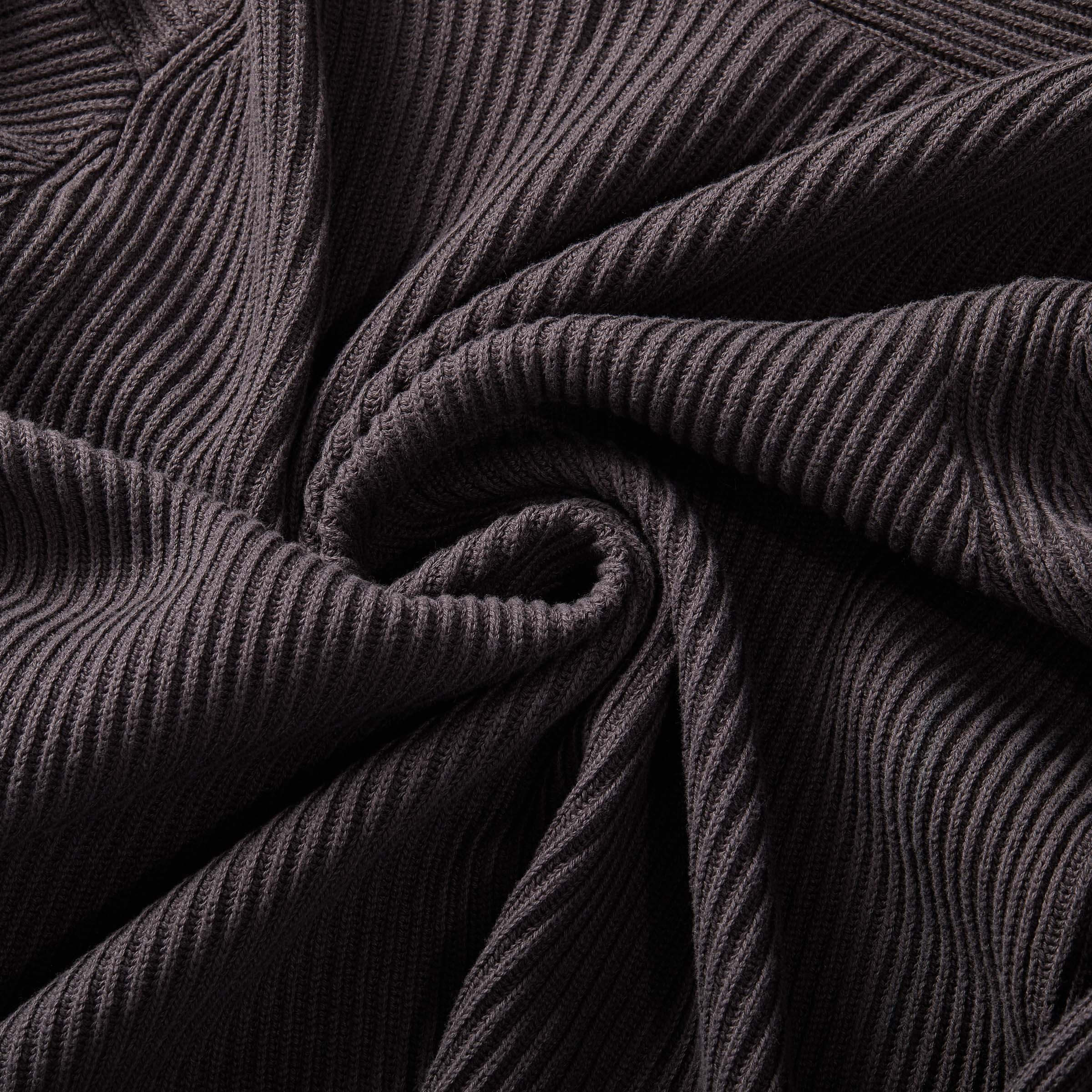 Close-up of soft ribbed fabric texture in charcoal, perfect for an adaptive cardigan design.
