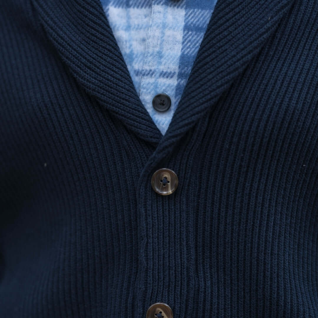 Navy ribbed cardigan with shawl collar and magnetic buttons, showcasing premium comfort and stylish design.
