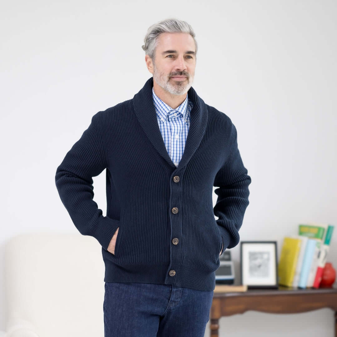 Navy adaptive ribbed cotton cardigan with magnetic buttons, worn by a man, featuring pockets and a shawl collar.