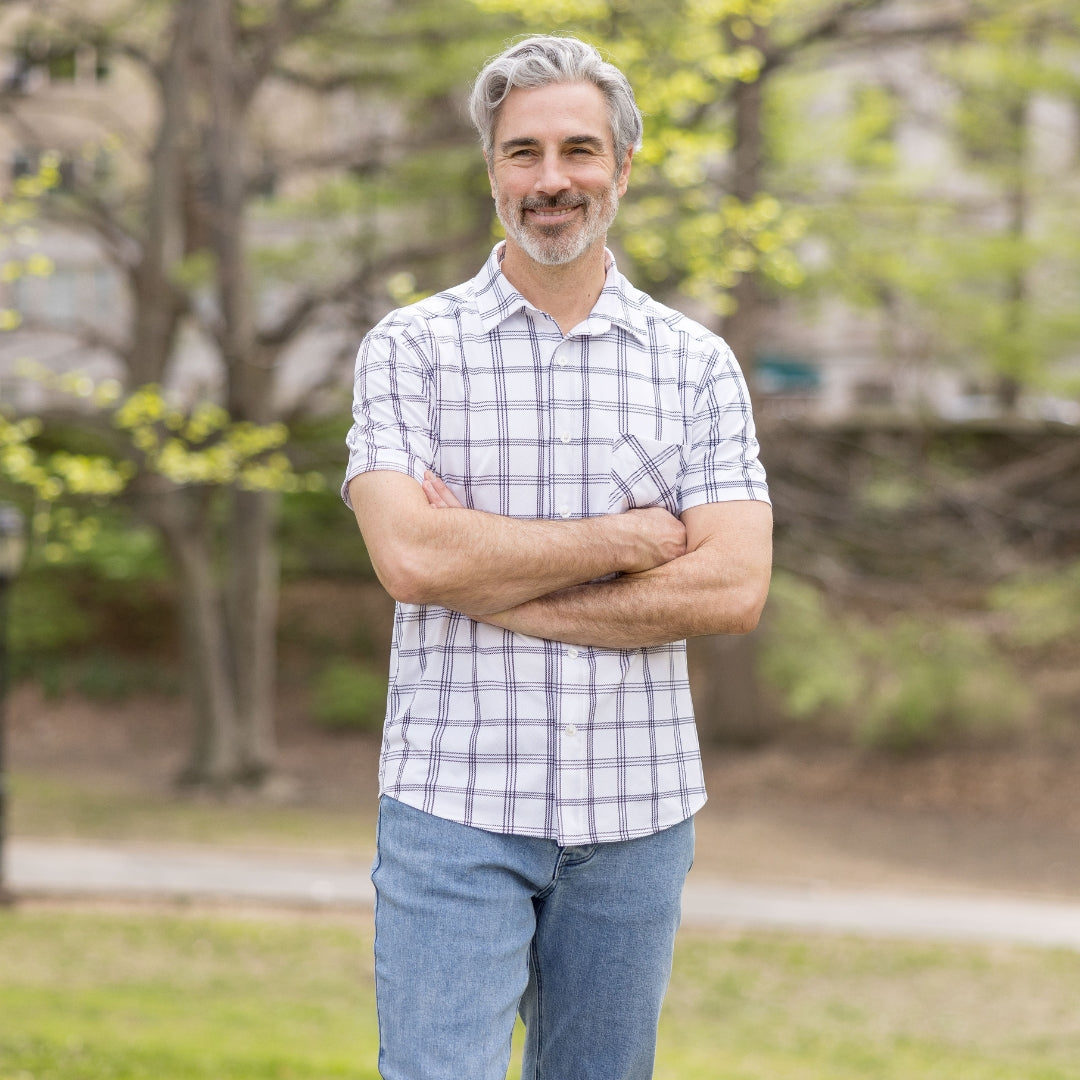 Adaptive Cooling Magnetic Front Short Sleeve Shirt in White Windowpane worn by a smiling man outdoors.